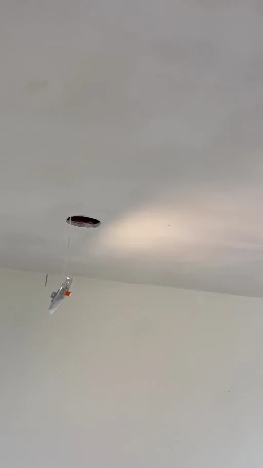 Video still showing the flatter ceiling surface after smoothing, before final LED fitting.